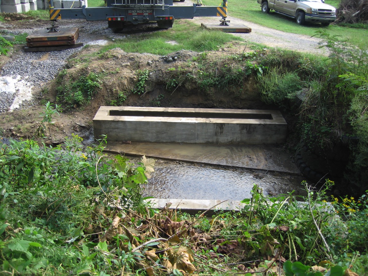 Footer for three sided box culvert